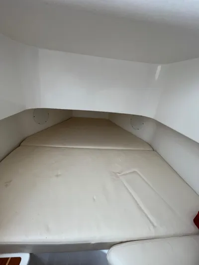  Yacht Photos Pics Interior cabin of 2022 Edgewater 285CC boat with cushioned seating.