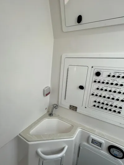  Yacht Photos Pics 2022 Edgewater 285CC boat interior with control panel and sink.