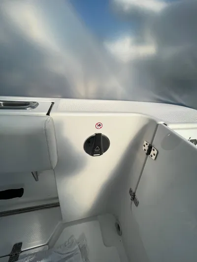  Yacht Photos Pics 2022 Edgewater 285CC boat interior with sleek white design and modern fittings.