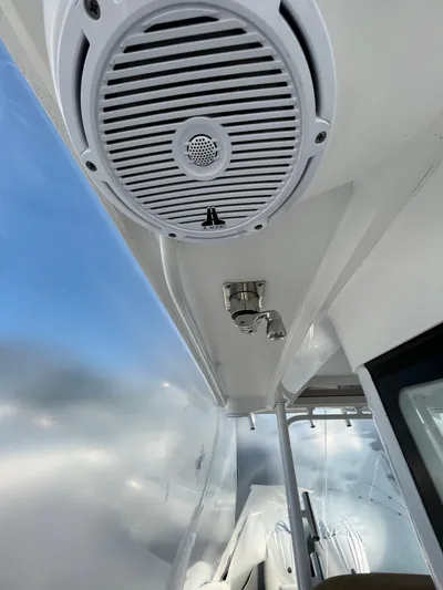  Yacht Photos Pics 2022 Edgewater 285CC boat interior with speaker and stainless steel fixtures.