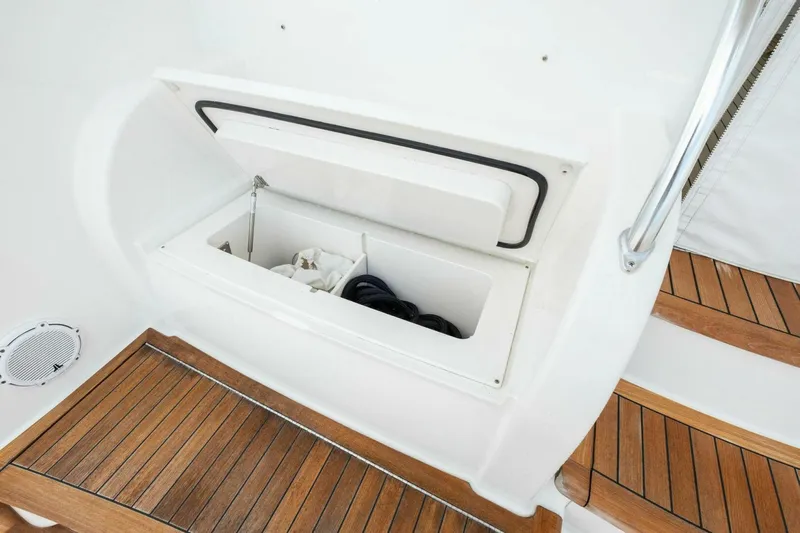 Terrabbean Yacht Photos Pics Storage compartment on 2015 Viking 52 Open yacht with wooden steps and railing.