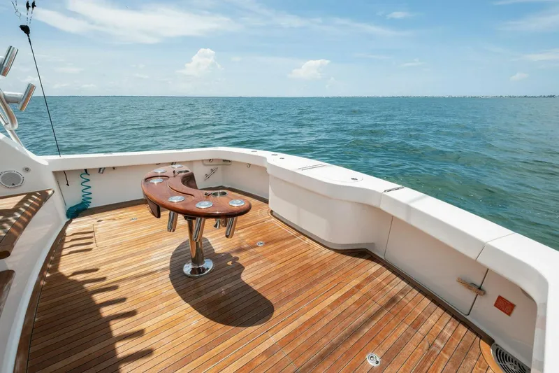 Terrabbean Yacht Photos Pics 2015 Viking 52 Open yacht deck with wooden flooring, ocean view, and fishing rod holders.
