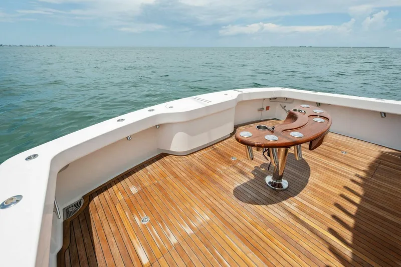 Terrabbean Yacht Photos Pics 2015 Viking 52 Open yacht deck with wooden flooring and ocean view.