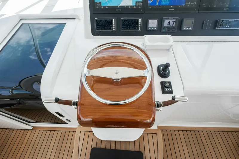Terrabbean Yacht Photos Pics Steering wheel and controls of a 2015 Viking 52 Open yacht.