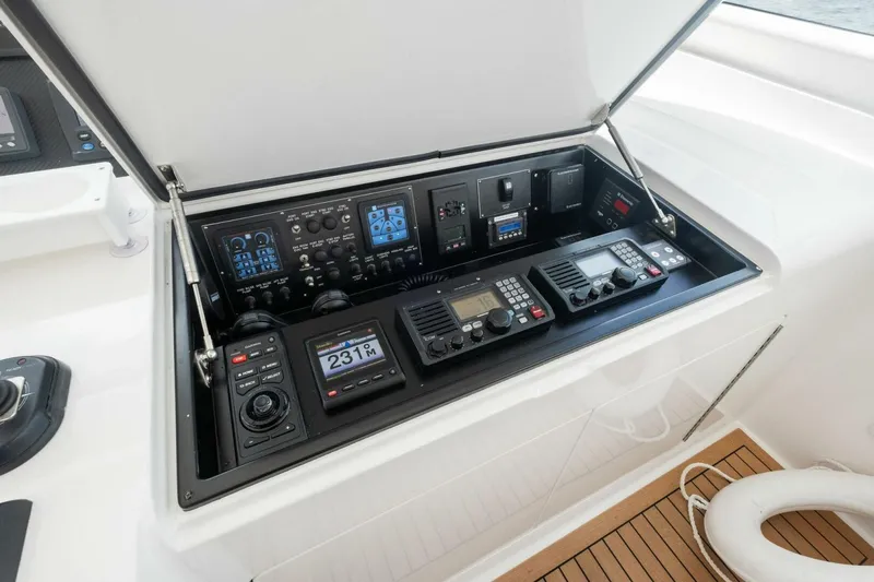 Terrabbean Yacht Photos Pics Control panel of a 2015 Viking 52 Open yacht, featuring navigation and communication equipment.