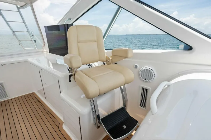 Terrabbean Yacht Photos Pics 2015 Viking 52 Open yacht helm seat with ocean view and teak flooring.