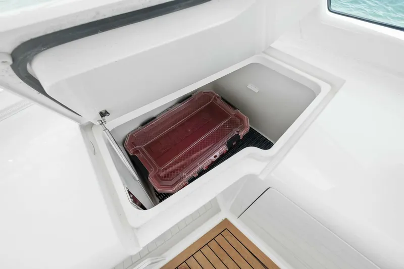 Terrabbean Yacht Photos Pics Storage compartment on 2015 Viking 52 Open yacht with a red container inside.