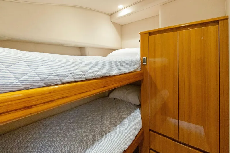 Terrabbean Yacht Photos Pics Bunk beds and wooden cabinet in 2015 Viking 52 Open yacht interior.