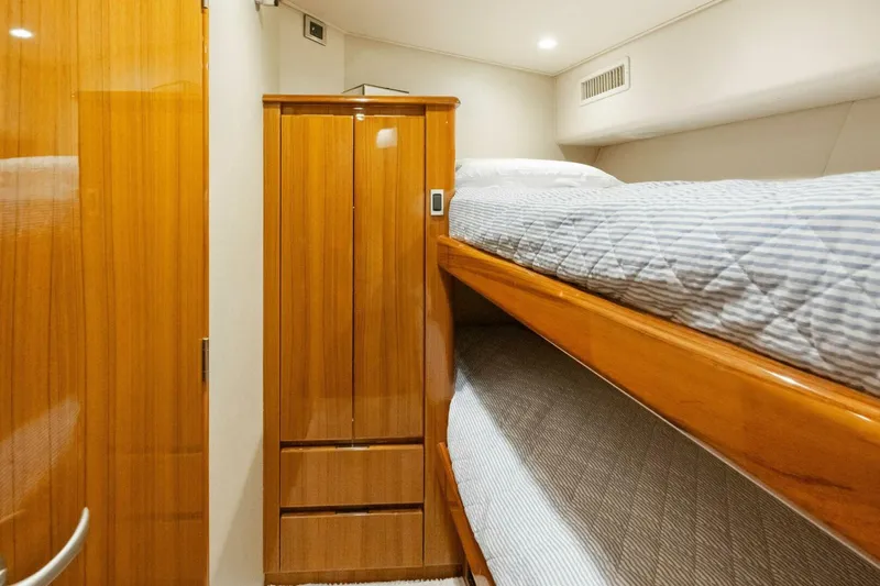 Terrabbean Yacht Photos Pics 2015 Viking 52 Open yacht interior with wooden cabinetry and bunk beds.