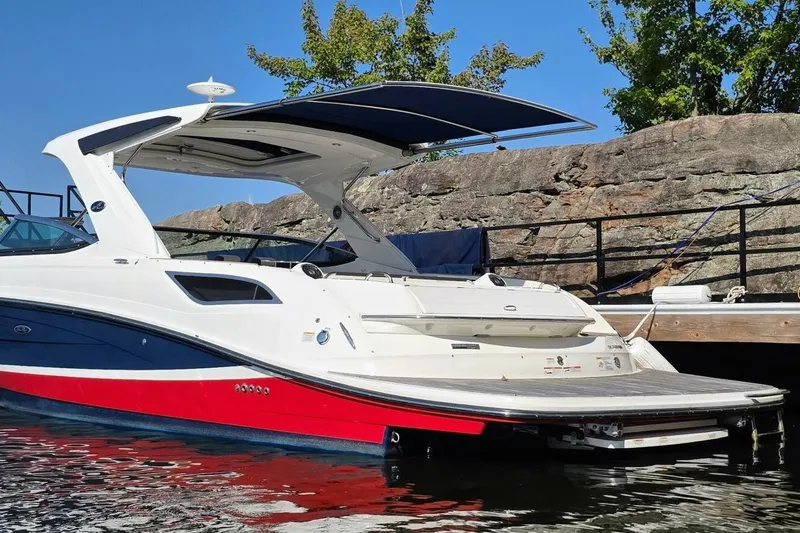  Yacht Photos Pics 2019 Sea Ray 350 SLX boat docked, featuring sleek design and vibrant red hull.