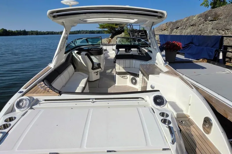  Yacht Photos Pics 2019 Sea Ray 350 SLX boat interior with seating, speakers, and lake view.