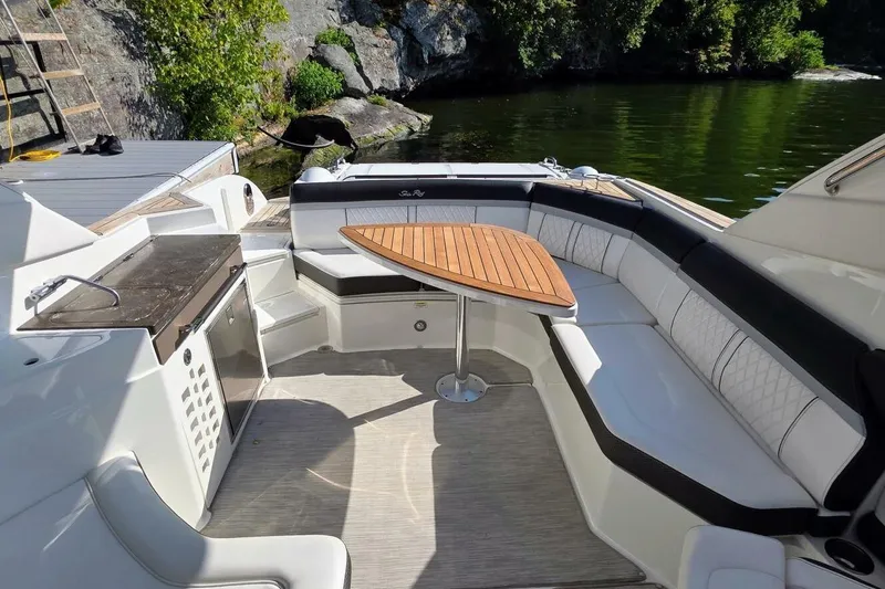  Yacht Photos Pics Luxurious 2019 Sea Ray 350 SLX boat interior with elegant seating and wooden table.