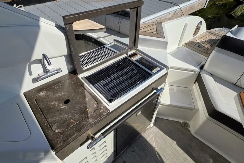  Yacht Photos Pics Outdoor kitchen on 2019 Sea Ray 350 SLX boat with sink and grill.