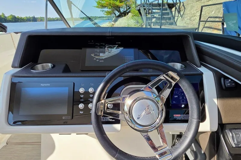  Yacht Photos Pics 2019 Sea Ray 350 SLX boat dashboard with steering wheel and digital displays.