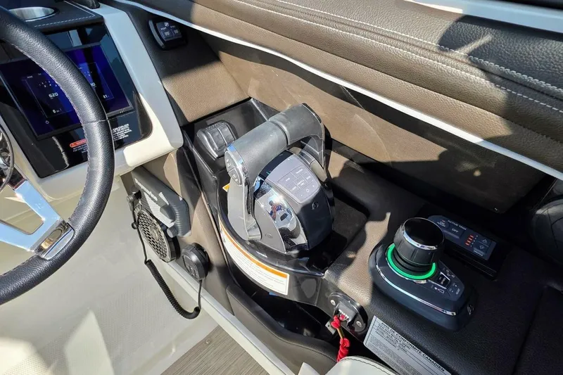  Yacht Photos Pics 2019 Sea Ray 350 SLX helm with steering wheel, throttle controls, and navigation system.