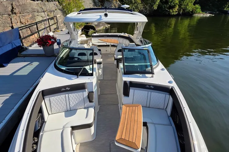  Yacht Photos Pics 2019 Sea Ray 350 SLX luxury boat docked on calm water, featuring spacious seating.