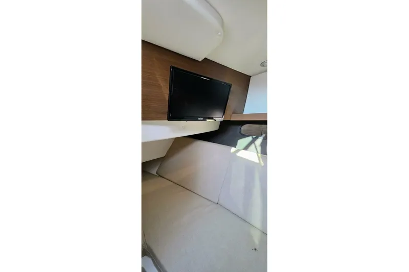  Yacht Photos Pics Interior of 2019 Sea Ray 350 SLX boat with TV and seating area.