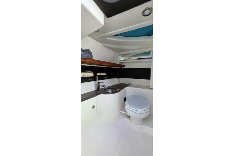  Yacht Photos Pics Interior of 2019 Sea Ray 350 SLX boat bathroom with sink and toilet.
