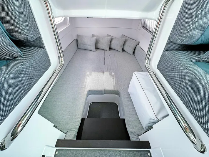  Yacht Photos Pics 2024 Axopar 37XC CROSS CABIN interior with cozy gray seating and cushions.