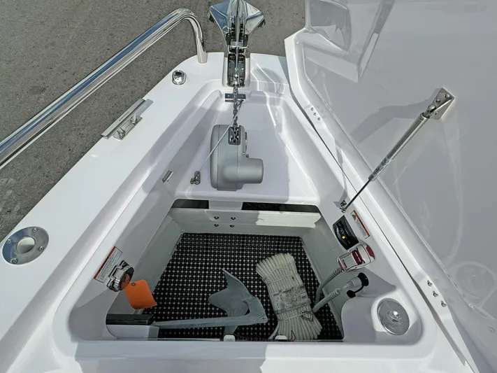  Yacht Photos Pics 2024 Axopar 37XC CROSS CABIN anchor storage compartment with anchor and rope.