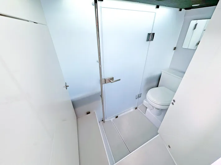  Yacht Photos Pics 2024 Axopar 37XC CROSS CABIN bathroom with modern shower and toilet.