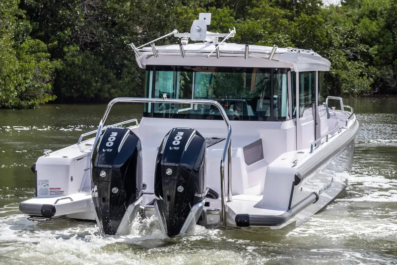  Yacht Photos Pics 2024 Axopar 37XC CROSS CABIN with dual 300 V8 engines cruising on water.