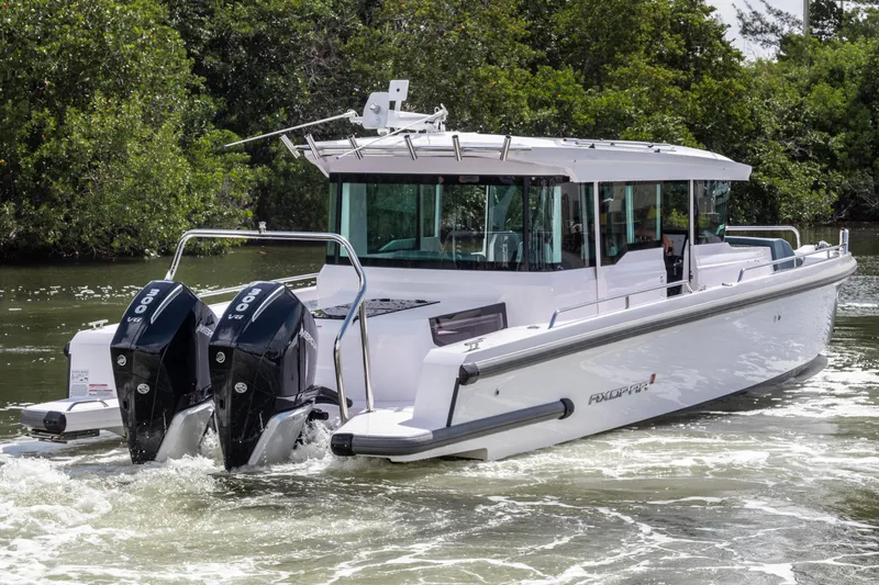  Yacht Photos Pics 2024 Axopar 37XC CROSS CABIN boat with dual engines cruising on water.