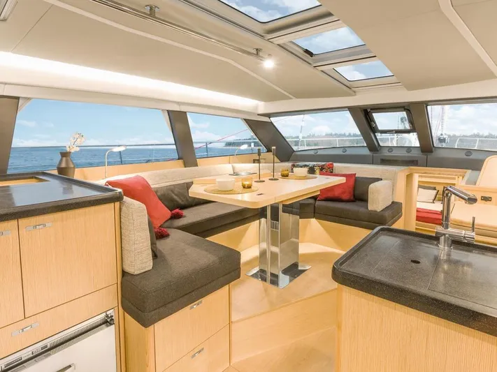  Yacht Photos Pics Luxurious interior of 2025 Moody 54 DS yacht with modern design and panoramic windows.
