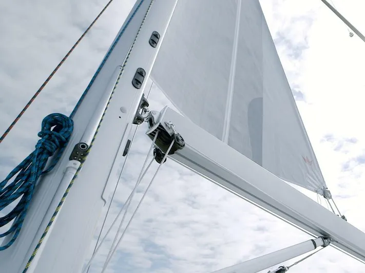  Yacht Photos Pics Sailboat mast and rigging of 2025 Moody 54 DS against cloudy sky.