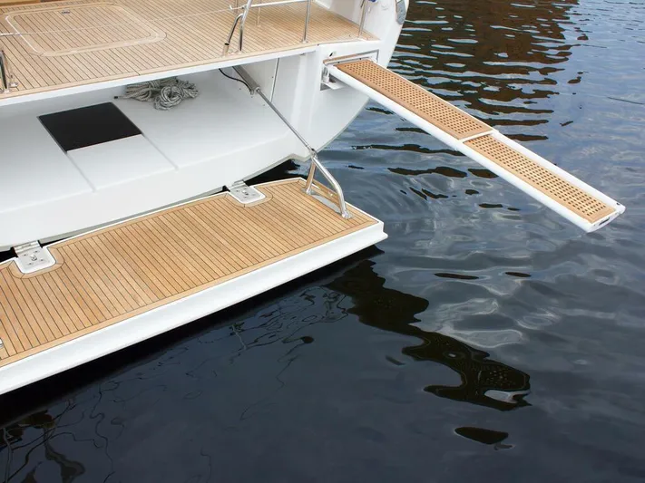  Yacht Photos Pics Luxury yacht Moody 54 DS 2025 with teak swim platform and retractable gangway.