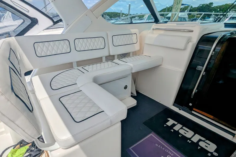  Yacht Photos Pics Luxurious seating area on a 2005 Tiara Yachts 3200 Open, featuring elegant white upholstery.