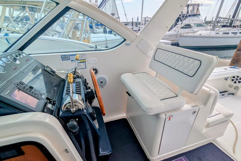  Yacht Photos Pics 2005 Tiara Yachts 3200 Open helm with luxurious seating and control panel.