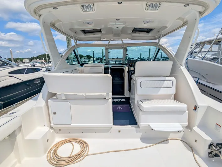  Yacht Photos Pics 2005 Tiara Yachts 3200 Open interior with seating and helm, docked at marina.