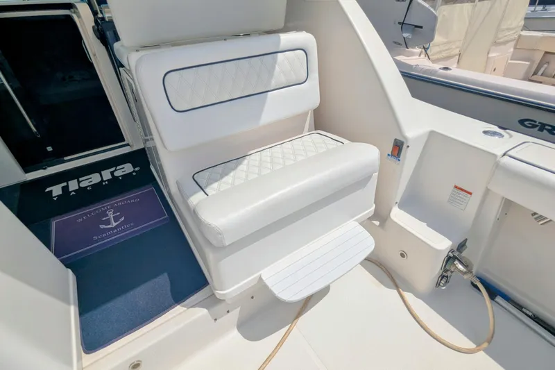  Yacht Photos Pics 2005 Tiara Yachts 3200 Open interior with white seating and welcome mat.