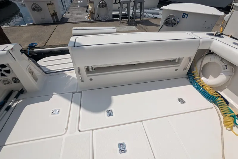  Yacht Photos Pics 2005 Tiara Yachts 3200 Open deck with seating and storage compartments.