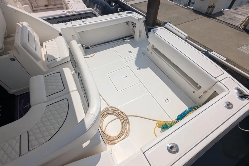  Yacht Photos Pics 2005 Tiara Yachts 3200 Open boat deck with seating and coiled ropes.