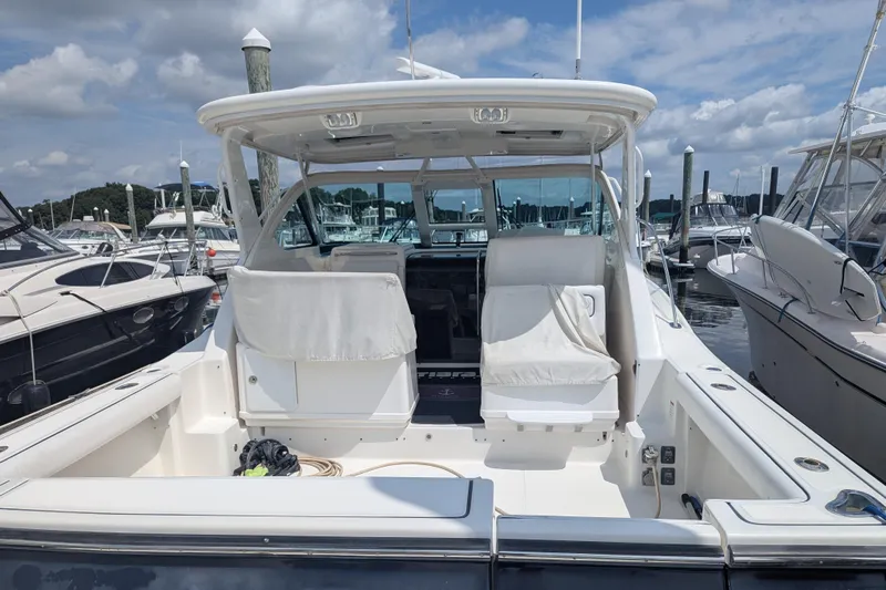  Yacht Photos Pics 2005 Tiara Yachts 3200 Open at marina, featuring spacious deck and seating.