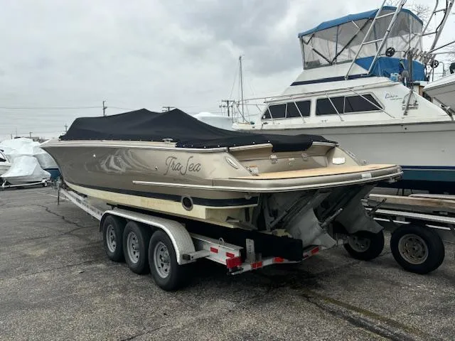  Yacht Photos Pics 2014 Chris-Craft Launch 32 boat on trailer, covered, parked in marina.