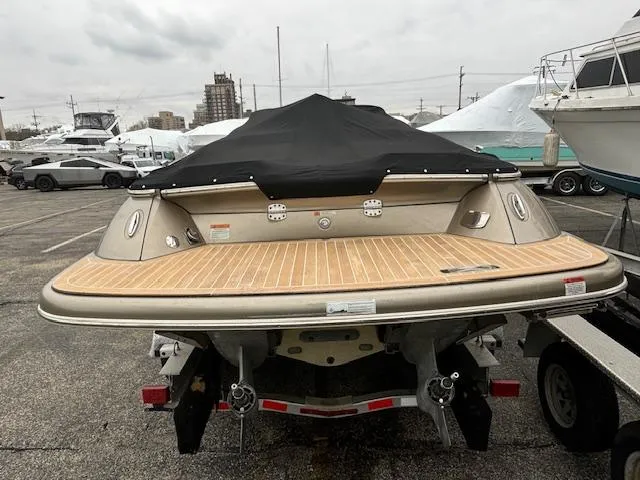  Yacht Photos Pics 2014 Chris-Craft Launch 32 boat with covered deck on trailer in marina.