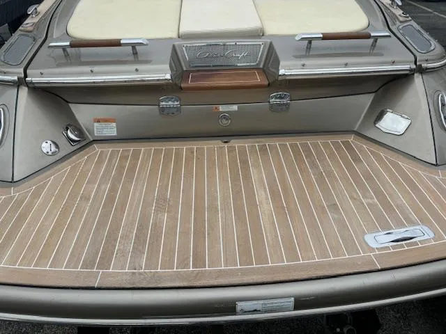  Yacht Photos Pics 2014 Chris-Craft Launch 32 boat with teak swim platform and cushioned seating.