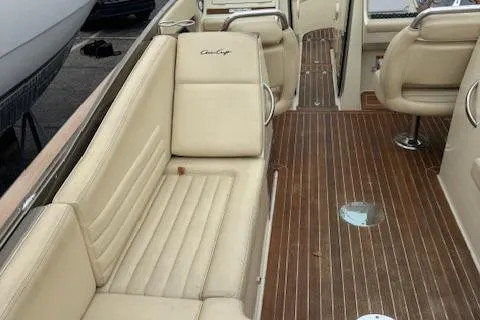  Yacht Photos Pics 2014 Chris-Craft Launch 32 interior with beige seating and wooden flooring.
