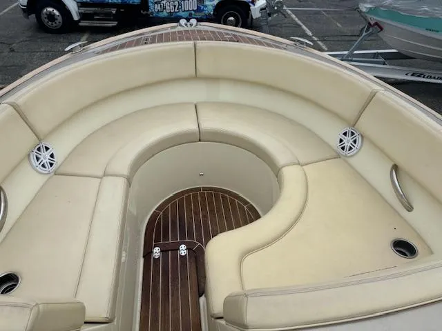  Yacht Photos Pics 2014 Chris-Craft Launch 32 boat with beige seating and wood flooring.