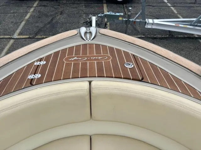  Yacht Photos Pics 2014 Chris-Craft Launch 32 boat with teak deck and beige seating.