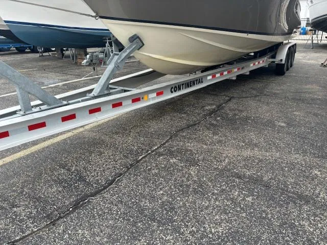  Yacht Photos Pics 2014 Chris-Craft Launch 32 boat on Continental trailer in parking lot.