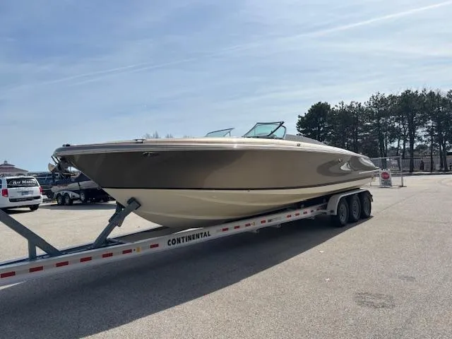  Yacht Photos Pics 2014 Chris-Craft Launch 32 boat on trailer in parking lot.