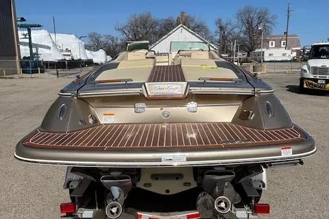  Yacht Photos Pics 2014 Chris-Craft Launch 32 boat, rear view, parked on trailer in outdoor setting.