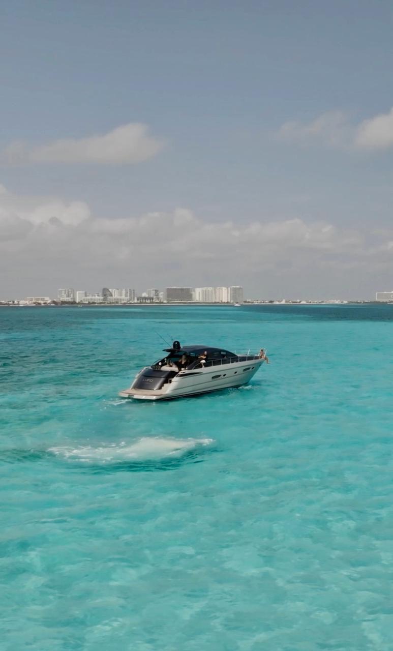 Luxury Pershing 56 yacht cruising in turquoise waters, 2009 model.