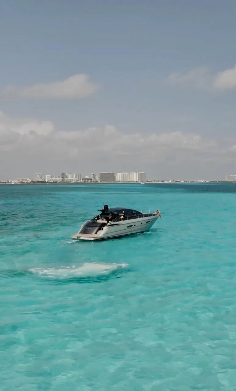 Luxury Pershing 56 yacht cruising in turquoise waters, 2009 model.