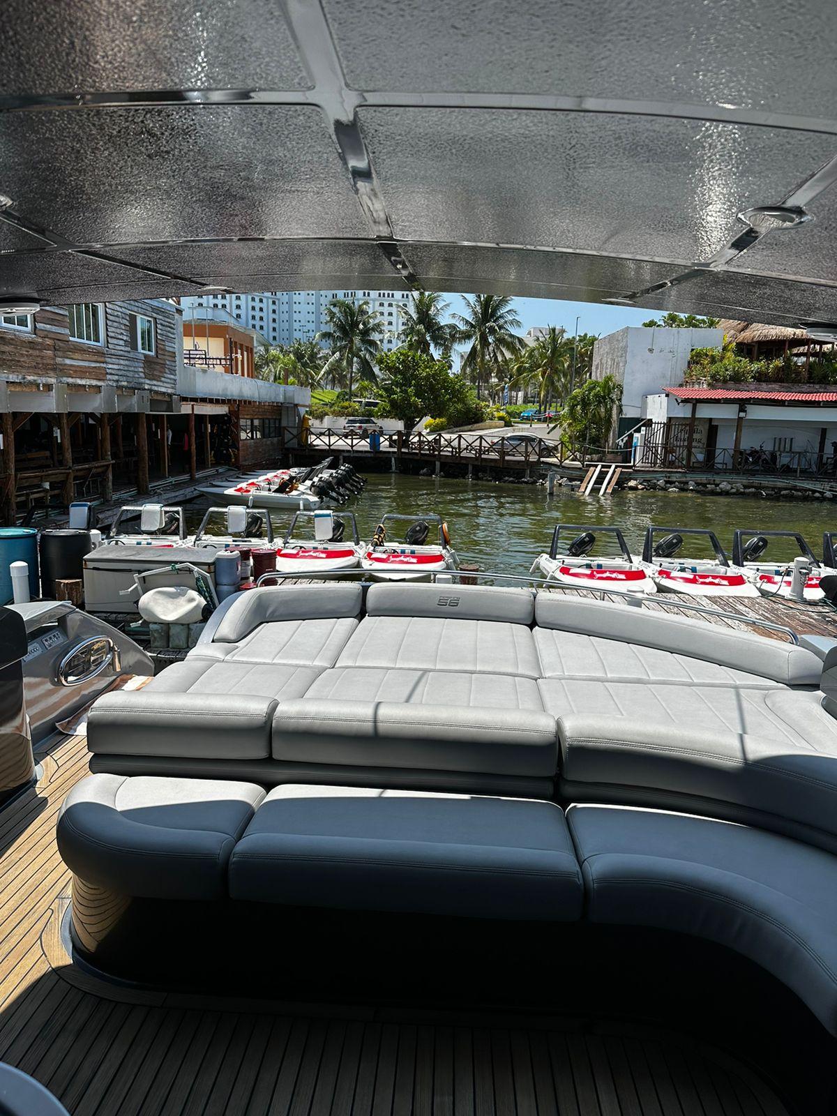 2009 Pershing 56 yacht with spacious deck and waterfront view.