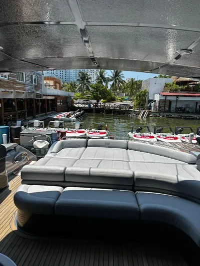 Lupo Yacht Photos Pics 2009 Pershing 56 yacht with spacious deck and waterfront view.